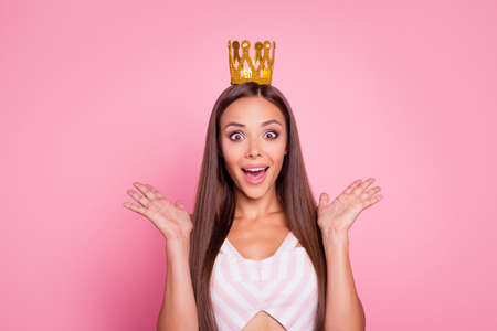 Photo of cool impressed young lady dressed summer clothes hair accessory open mouth rising hands isolated pink color backgroundの写真素材