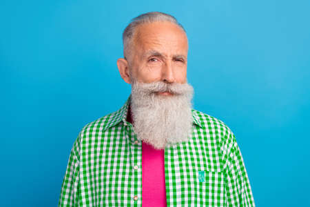 Portrait of minded person dissatisfied disapprove look camera isolated on blue color background