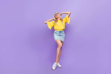 Full size photo of adorable stunning gorgeous lady sunbathing enjoy weekend isolated on violet color...