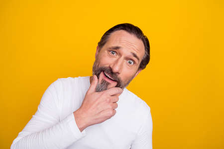 Photo of think mature brunet man hand face wear white shirt isolated on yellow color background
