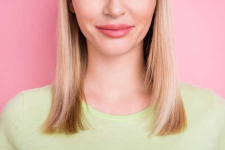 Cropped photo of charming lady lips botox injection advertisement wear green t-shirt isolated on pink backgroundの写真素材