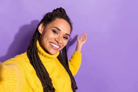 Photo of impressed brunette lady do selfie hold hand wear yellow sweater isolated on purple color...