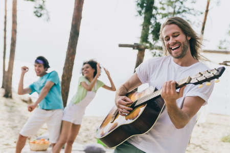Portrait of attractive cheerful best friends friendship having fun dancing playing rock pop at bank...
