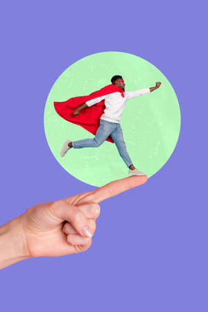 Vertical collage image of huge arm finger point indicate way small guy superman raise fist fly isolated on painted backgroundの写真素材
