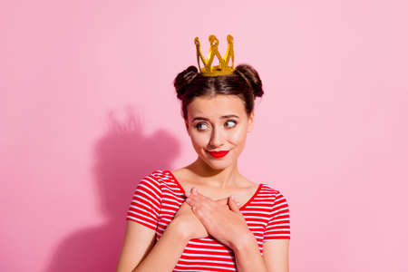 Portrait of adorable nice person arms chest look empty space isolated on pink color backgroundの写真素材