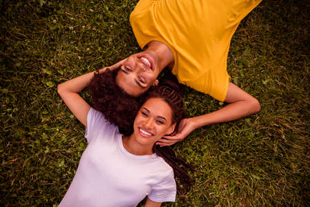 Top above high angle view portrait of attractive handsome cheerful couple life partners lying on...