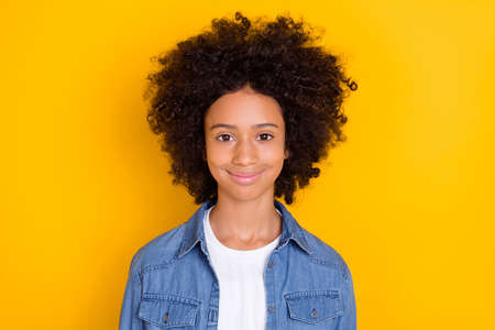Portrait of attractive cheery brunet cute wavy-haired girl bushy hairdress isolated over bright...