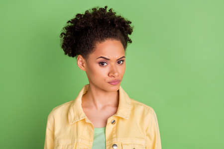 Photo of angry young brunette lady look wear yellow shirt isolated on green color background