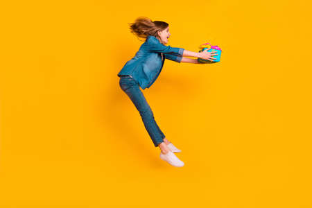 Full body profile portrait of beautiful carefree person jump fall arms hold giftbox isolated on...