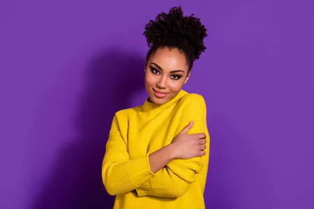 Photo of attractive peaceful lady embrace shoulders look camera isolated on violet color background