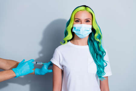 Photo of funny positive vivid ombre hair lady wear t-shirt respirator protective vaccine isolated white color backgroundの写真素材