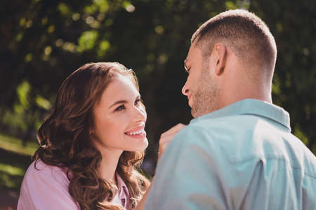 Portrait of two cheerful peaceful partners look each other trust support enjoy nice weather outsideの写真素材