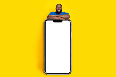 Full length body size view of handsome trendy cheery guy showing copy space ad bargain isolated on...