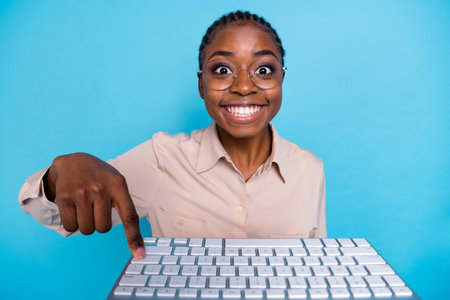 Close-up photo of geek girl office worker have online group chat with colleagues isolated on blue color backgroundの写真素材