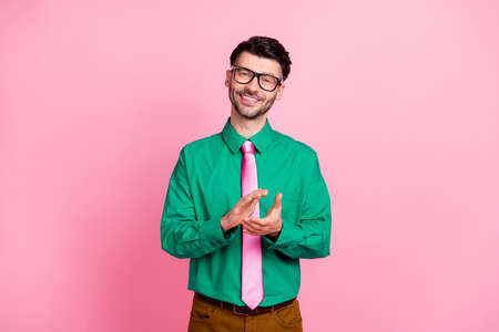 Photo of young attractive guy hr manager clapping hands celebrate new worker office isolated on pink color backgroundの写真素材