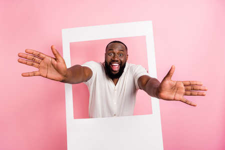 Photo of amazed excited person raise opened hands camera you invite isolated on pink color backgroundの写真素材