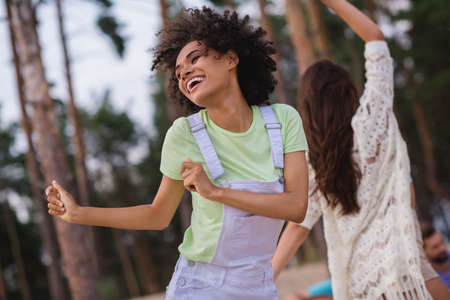 Photo of young brunette lady dance wear casual cloth on the beach party