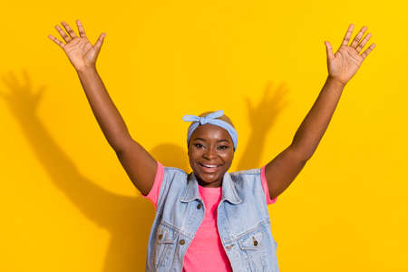 Portrait of cheerful excited person raise opened arms toothy smile isolated on yellow color...