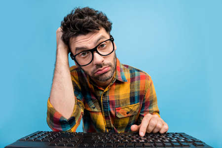 Photo of upset tired freelancer in specs dressed checked shirt look at webcam on remote video call...