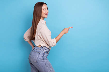 Photo of pretty lovely lady fashionable clothes outfit arm direct empty space offer quality clothes...