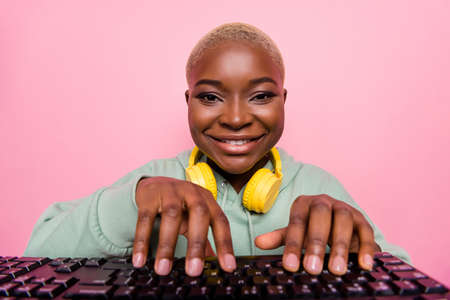 Photo of pretty girl freelancer programmer coding making new software program isolated on pink color backgroundの写真素材