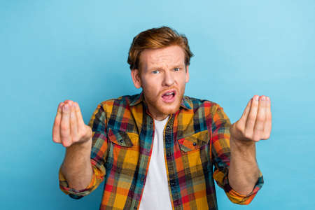 Portrait of young man wear stylish shirt not undestanding how use technologies need help isolated on...