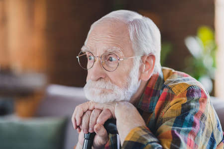 Photo of frustrated lonely minded granddad white hair lean walking cane dressed casual plaid clothes...