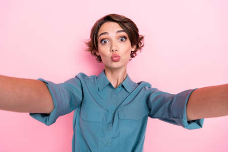 Portrait of nice lovely girlish gorgeous woman bob hairdo wear blue blouse doing selfie send kiss to...