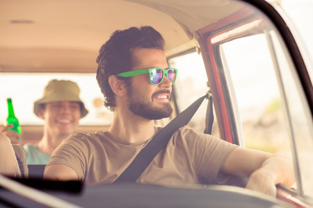 Photo of two cheerful positive guys sitting drive van have good mood enjoy vacation tourism