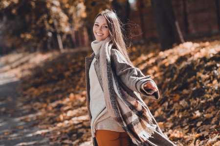 Profile photo of nice brown hairdo young lady look wear coat sweater at the street in autumn