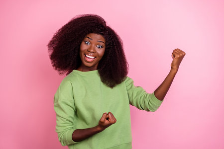 Photo of hooray wavy hairdo brunette lady yell wear green sweater isolated on pink color backgroundの写真素材