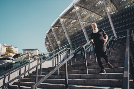 Full size photo of old white hair fast man show run wear black t-shirt shorts footwear outside in...