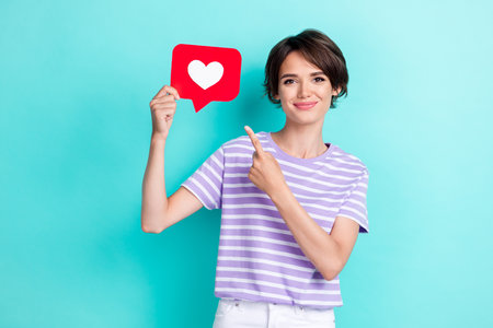 Portrait of gorgeous pretty nice positive woman wear striped t-shirt finger indicating like isolated...