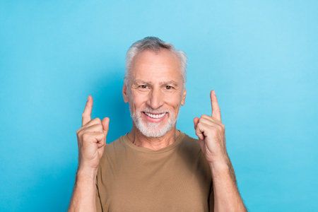 Portrait of positive man raise two arm direct empty space stomatology procedure sale discount low...