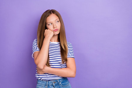 Photo of displeased upset girl straight hairdo wear striped t-shirt look empty space hand on...
