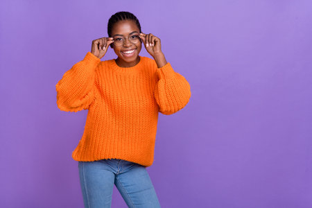 Portrait of charming glad person arms touch glasses beaming smile isolated on purple color backgroundの写真素材
