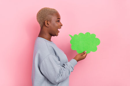 Profile photo of positive friendly person look empty space hold cloud card communicate isolated on...