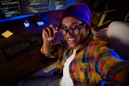 Photo of positive handsome guy make selfie hand touch eyeglasses night microsoft office workplaceの写真素材