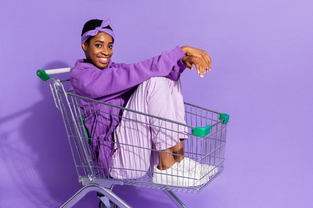 Photo of transgender sit cart enjoy rest shiny smile wear headband hoodie isolated purple color backgroundの写真素材