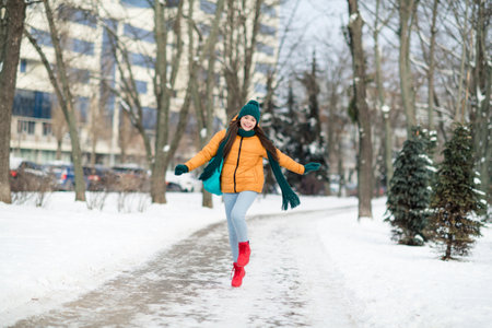Full length body size view of attractive cheerful funky girl wearing warm outfit jumping having fun snowy day outdoorsの写真素材