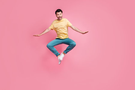 Full length photo of overjoyed crazy man wear comfort clothes rejoice win lottery millionaire luxury...