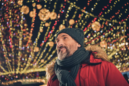 Photo of peaceful positive person toothy smile enjoy midnight weekend center outdoorsの写真素材