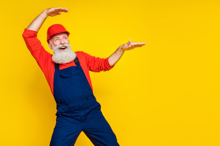 Photo of crazy pensioner automobile service worker look empty space dance active isolated on bright...