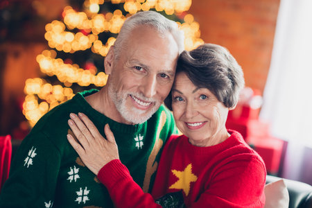 Photo of two peaceful idyllic partners cuddle toothy smile magic christmastime spirit house indoors