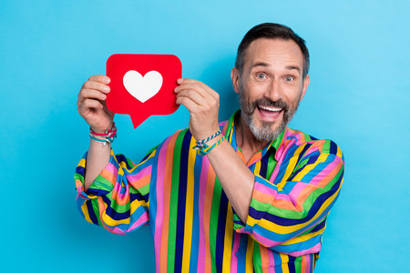 Photo of mature age excited positive instragram user man wear hipster retro fashion shirt hold like...