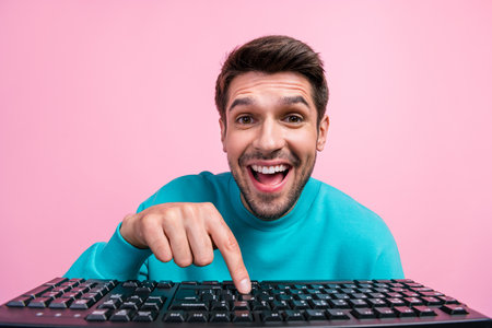 Photo portrait of handsome young man press key keyboard funny facial expression dressed stylish blue...