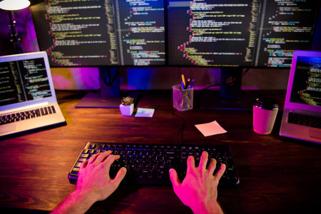 Photo of guy hands arms working front back end programming indoors workstation workshop homeの写真素材
