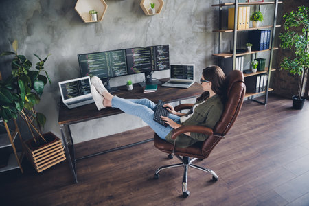 Photo of happy smiling lady freelancer wear glasses creating framework modern gadget indoors...