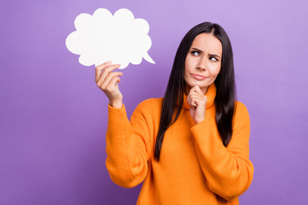 Photo of young funny lady wear orange stylish pullover touch paper cloud minded touch chin look...