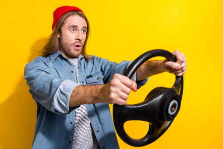 Photo of astonished impressed guy dressed jeans shirt hold steering wheel look at accident empty...